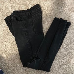 Ashley Mason black skinny jeans with holes in knees